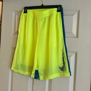 Nike boys dry fit shorts XL. Neon yellow with blue/teal stripes. New without tag
